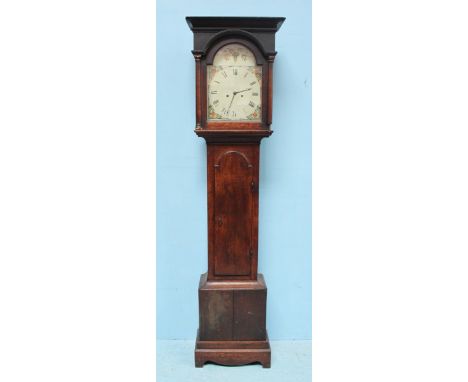 An early 19th century 8-day longcase clock, with painted 11.5" square dial with arched top, the stained oak case with caddy t