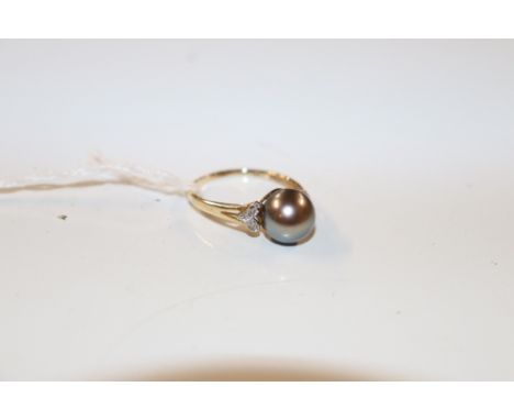 A 14ct gold pearl and chip diamond set ring, approx. 2.8gms total weight 