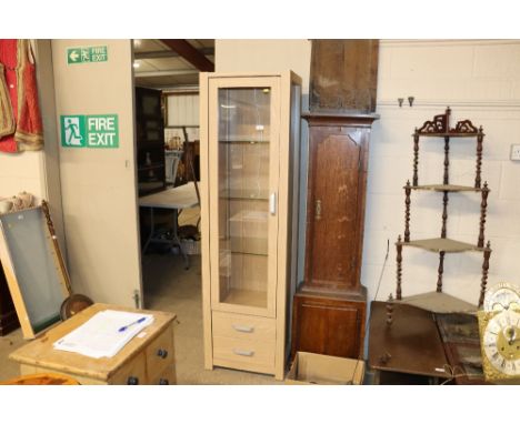 A light oak effect display cabinet 