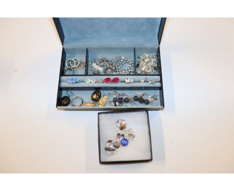 A grey box and contents of various costume jewellery and a silver plated and enamel bracelet