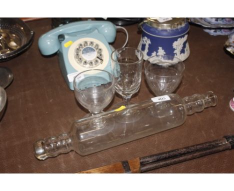 A Victorian glass rolling pin and three glasses 