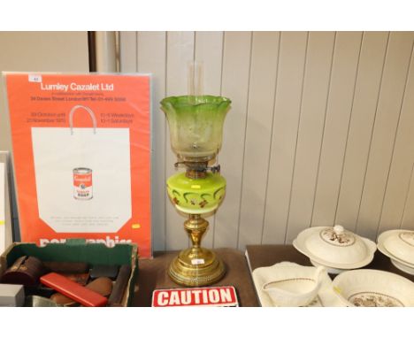 A Victorian oil lamp with green glass reservoir and floral decoration&nbsp; AF; and an opaque translucent and green tinged sh