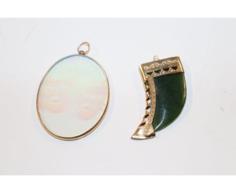 A yellow metal mounted hologram pendant, and a yellow metal mounted and jade coloured pendant