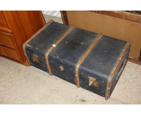 A wooden and metal bound travelling trunk