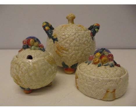 Clarice cliff celtic harvest biscuit barrel and the preserve pots. 