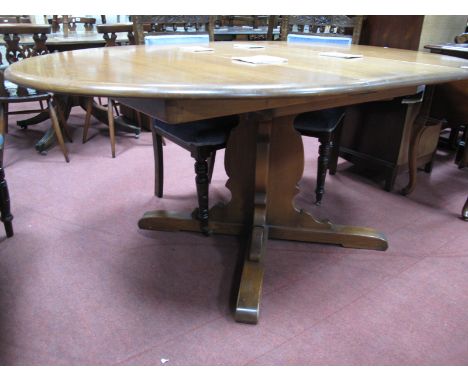 Ercol Extending Draw Leaf Dining Table, with 'D' ends on cruciform base, labelled.