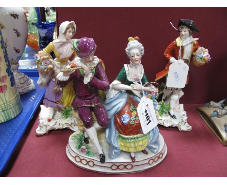 A Pair of Capodimonte Style Figurines, in classical dress both holding baskets, (with crown over letter N on base); together 