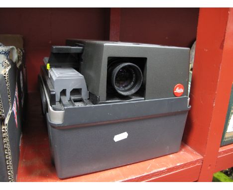 A Slide Projector, Leitz Pradovit CA 2502, together with a quantity of slides, (untested sold for parts only)