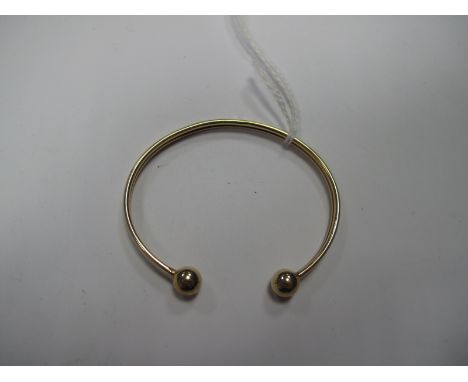 A 9ct Gold Torque Style Bangle, of plain design.