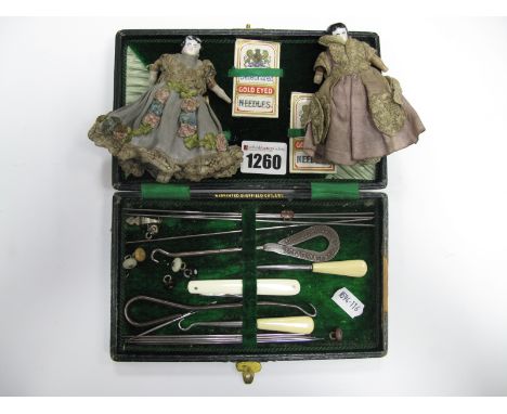 Two XIX Century Miniature Dolls House Dolls, in original clothing; together with a button hook set, with needles, etc; in ori