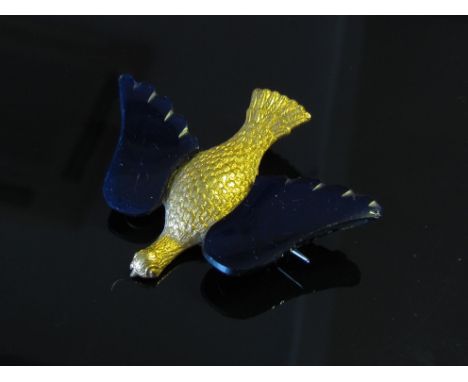 A Georgian gilt dove brooch with applied cobalt blue glass wings, possibly vauxhall glass