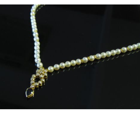 A pearl necklace with diamond and sapphire pendant    