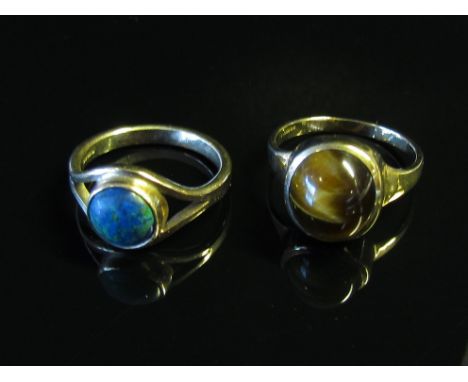 Two 9ct gold rings, one with cabochon tigers eye the other opal, sizes P &amp; O, 7.3g