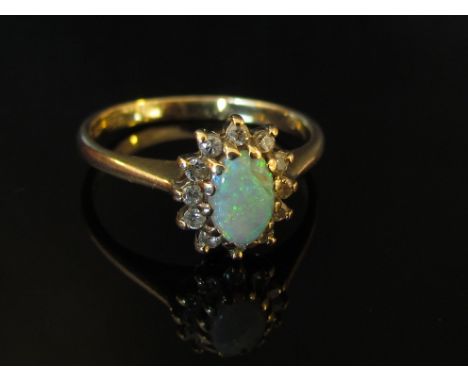 A 9ct gold opal and diamond ring, size K/L, 1.8g