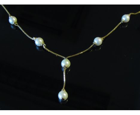 A gold box chain necklace with cultured pearl spacers and pearl droplet, stamped 750, 9.6g