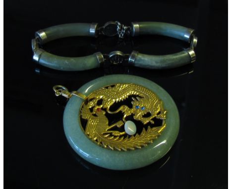 A Jade pendant set with dragon and pheasant, pair of earrings and associated bracelet