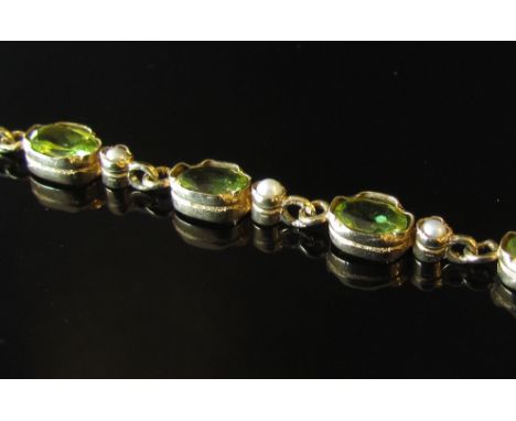 A gold peridot and seed pearl bracelet, 8.3g