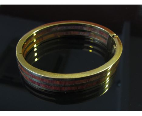 A gold and wood bangle, 12mm wide, three bands of gold interspersed with two rows of wood, marked VI, 44g