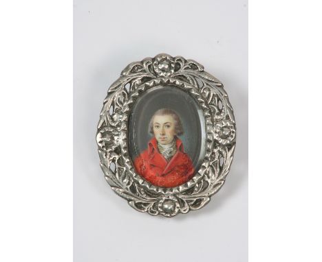A 19th Century portrait miniature on ivory, of a gentleman in a red coat, in contemporary pierced silver frame, 6.5cm x 5.5cm
