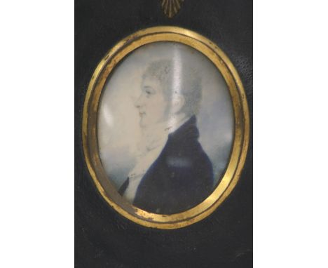 19th Century school, oval portrait miniature of a young gentleman in blue coat and stock, in ebonised and brass mounted frame