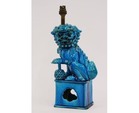 A Chinese turquoise pottery lamp base, in the form of a seated Kylin, 35cm high