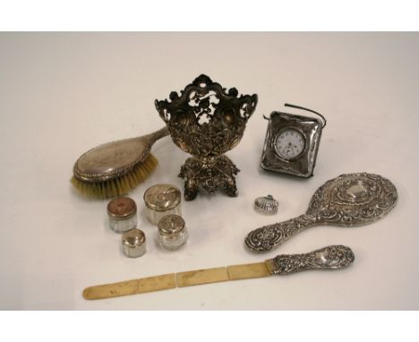 A late Victorian silver backed hand mirror, Birmingham 1900; a silver backed hair brush, Chester 1910; a plated pocket watch 