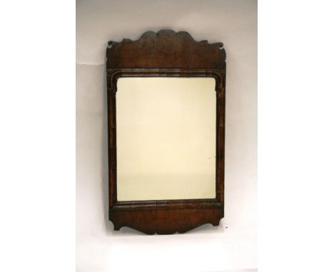 A small mahogany Chippendale style wall mirror, 66cm x 39cm in extremes