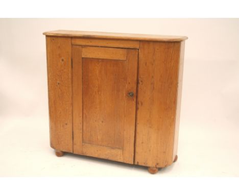 A Victorian stripped pine bow fronted plate cupboard, 107cm wide x 32.5cm deep x 96cm high