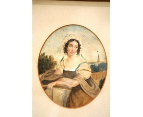 19th Century school, portrait study of a young girl seated in a field, unsigned watercolour, framed as an oval, 16cm x 13cm i