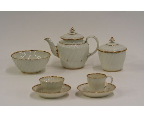 A late 18th Century Worcester white and gilt glazed tea service, comprising teapot and cover, sucrier and cover, slopes bowl,