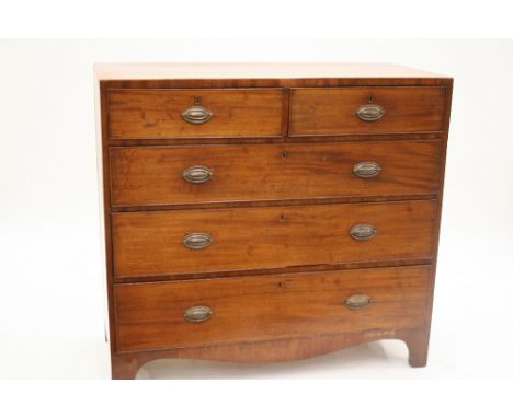 A Georgian mahogany chest, fitted two short and three long drawers, fitted brass drop handles and oval back plates, raised on