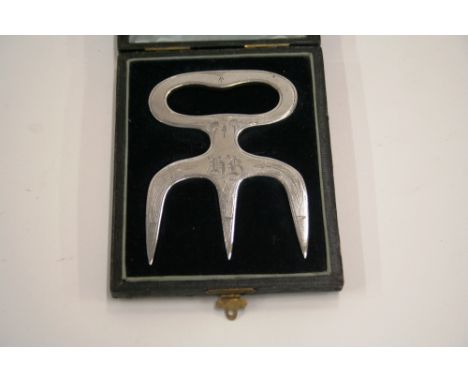 A late Victorian cased plated bread fork, initialled H.B.