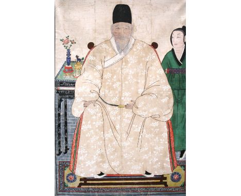 A Chinese ancestor painting, depicting a seated figure and attendant with scroll, in front of a side table and artefacts, unf