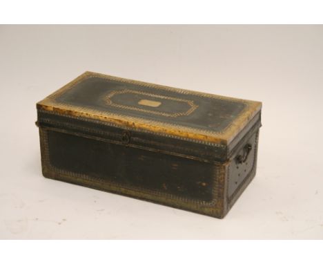 A 19th Century leather brass mounted and studded travelling trunk, paper lined interior, the lid inset with a plaque inscribe