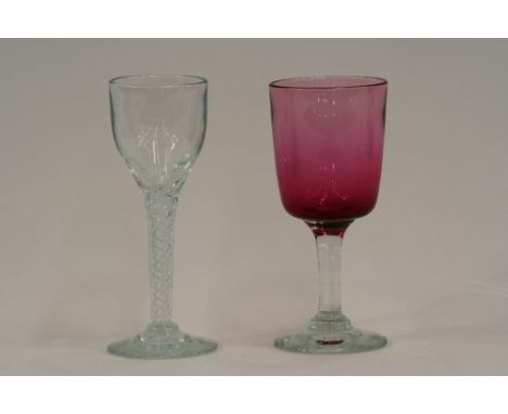 A 20th Century ruby glass goblet, having clear glass stem and circular spread foot; and a large wine glass with air twist ste