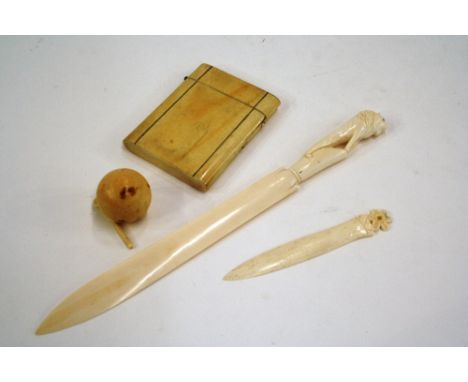 A 19th Century ivory visiting card case; a small ivory bagatelle ball; carved ivory paper knife etc.