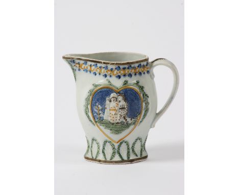 A late 18th Century Prattware baluster jug, decorated with children in a heart shaped motif, with raised foliate scrolls, 15c