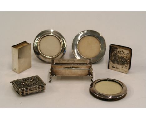 An Edwardian silver trinket box, Birmingham 1909; a silver mounted prayer book, Birmingham 1905; a silver matchbox holder; a 