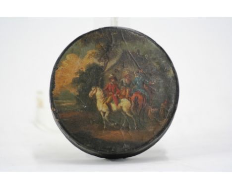 A 19th Century circular papier mache snuff box, the lid decorated in the Dutch style, with figures outside of a country inn, 