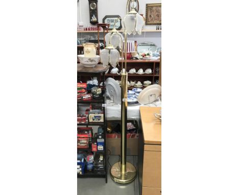 A 3 light brass effect standard lamp