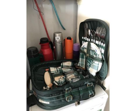 A picnic hamper and a quantity of flasks
