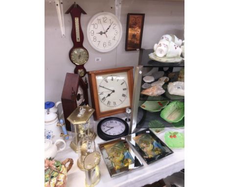 A quantity of clocks and a barometer