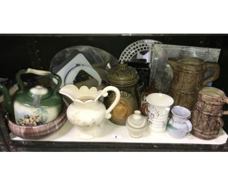 A shelf of pottery items including jugs, kettle, Rumtoft etc.