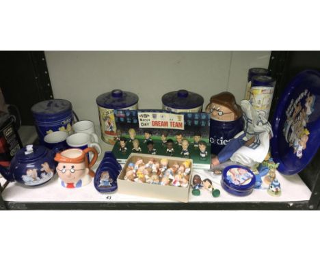 A shelf of Tetley advertising memorabilia