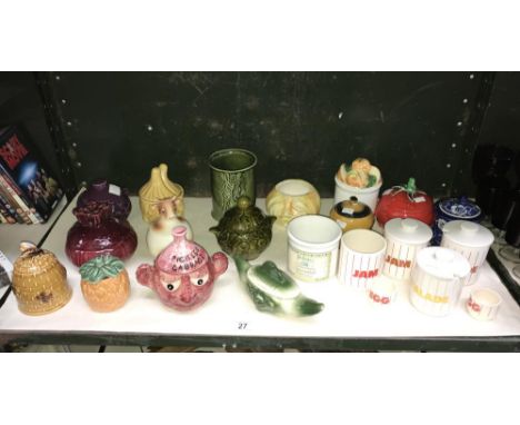 A shelf of novelty preserve pots including Sylvac and Hornsea