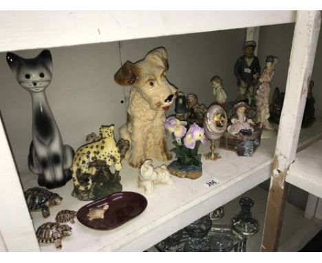 A shelf of figures &amp; animal ornaments