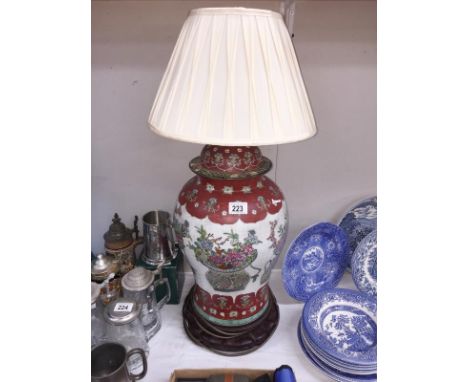 A large oriental lidded jar converted to table lamp with old repair