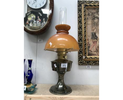 An Aladdin paraffin lamp with shade and chimney