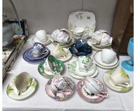A quantity of porcelain cups and saucers