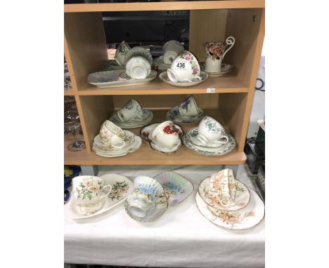 A quantity of porcelain cups and saucers